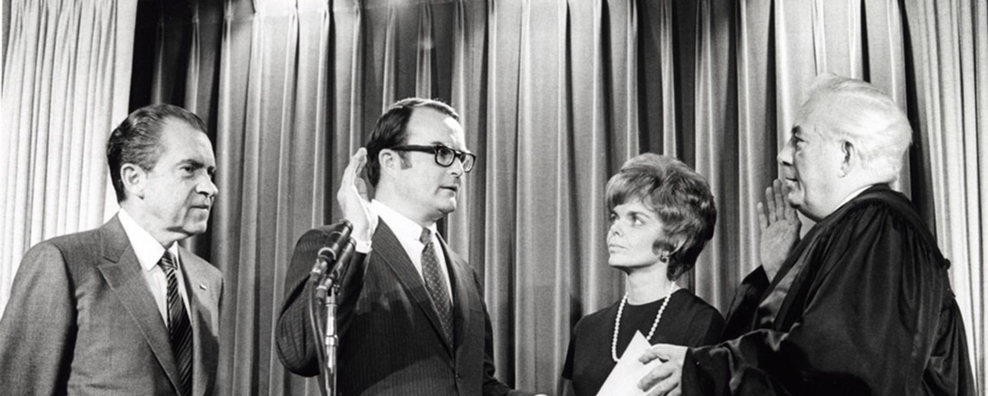 William Ruckelshaus being sworn in as the first chief administrator of the U.S. Environmental Protection Agency.  A policy institute, which promotes collaboration to solves disputes, bears his name at