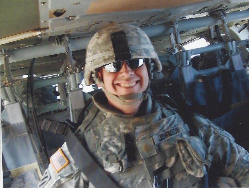 The author smiling in the back of a Black Hawk helicopter after the completion of another mission during operations in Iraq (2007). Photo courtesy Todd Johnson