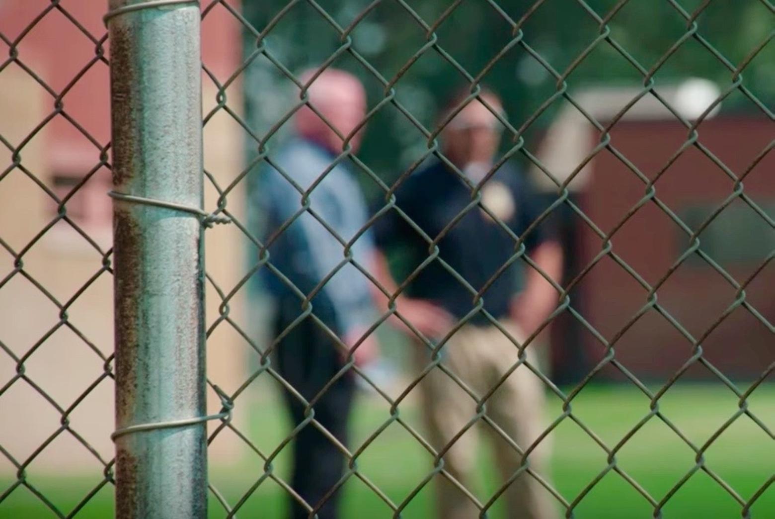 Corrections officials chat behind the fence at Pine Hills. All photos courtesy Montana State Fund