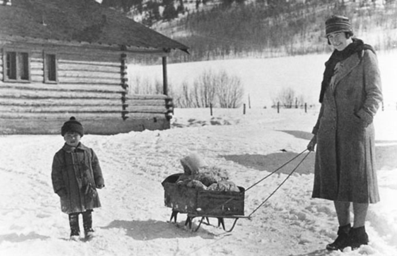 Martin Murie, left, with his sister in the sled, Joanne, being pulled by their mother Margaret E. Murie in Jackson Hole, 1930. Photo courtesy Murie Center, Moose, Wyoming