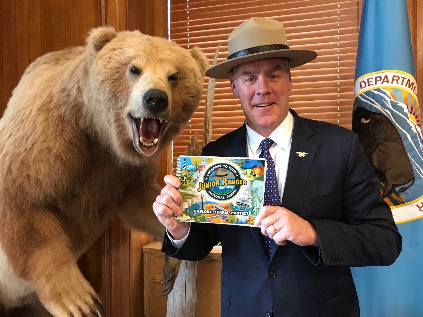 Master of photo-ops? Interior Secretary Ryan Zinke, already considered one of the most anti-conservation cabinet secretaries in modern U.S. history, poses for the camera.  Little did Zinke realize that he was wearing the official National Park Service hat backwards, a gesture considered offensive to those who have served in the ranks. Photo courtesy U.S. Department of Interior
