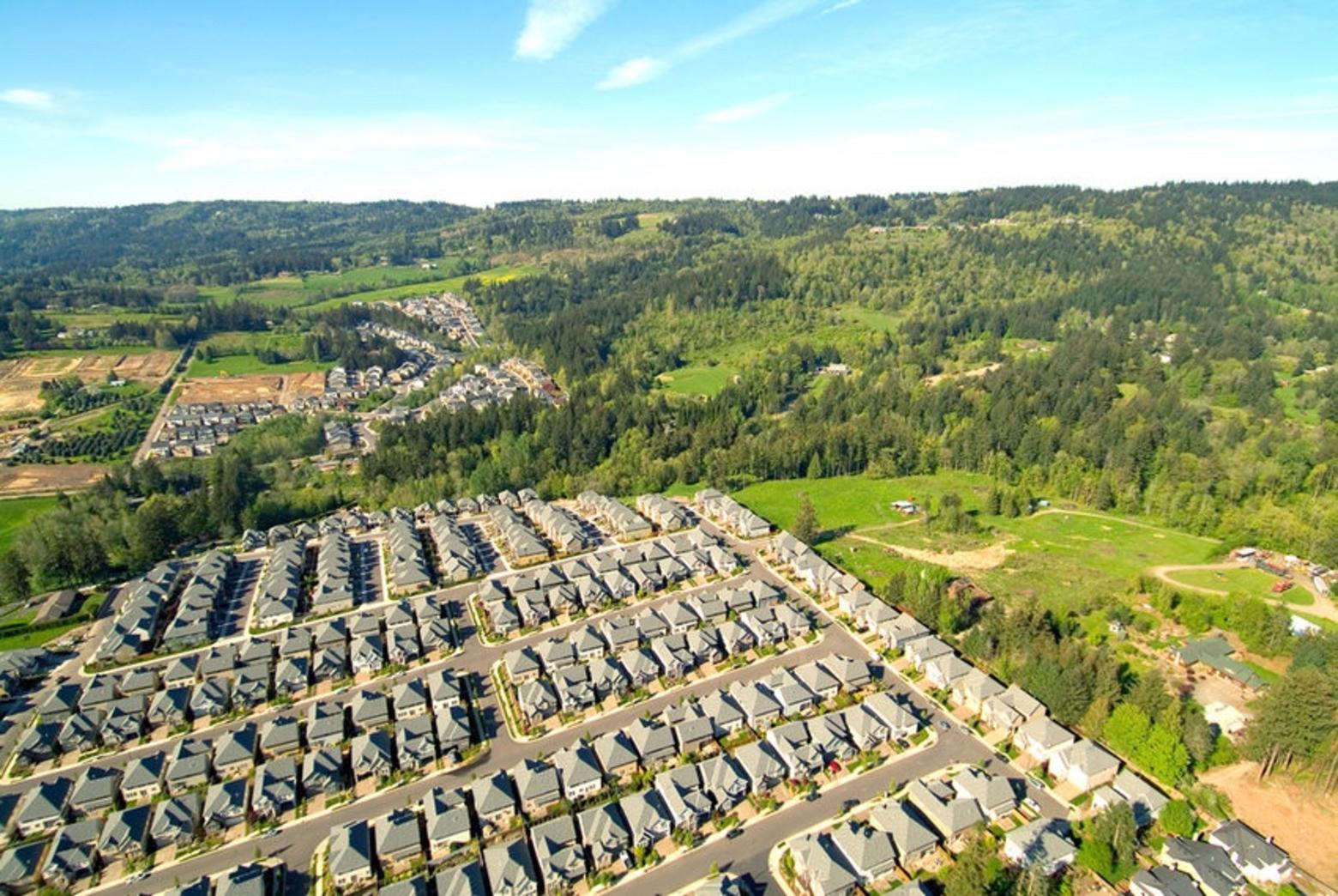 Another view of an urban growth boundary in Oregon where a town is surrounded by ag fields and forests, the latter without an invasion of homes that degrade wildlife habitat and are at high risk to loss from wildfire.