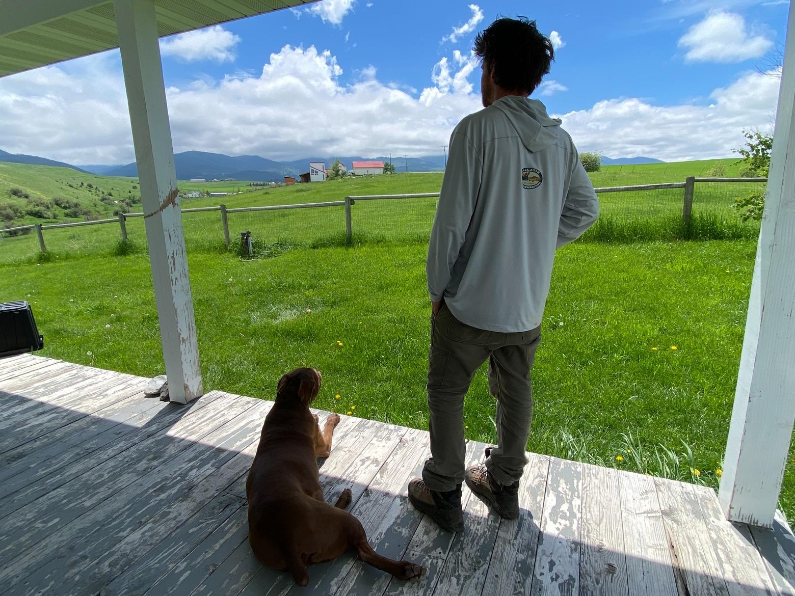 Keegan David and Ziggy stare off into the mountains from their home in Gallatin Gateway. Photo by Joseph T. O'Connor