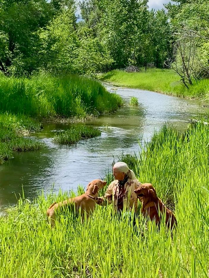 Peggy Lehmann with dogs Hondo and Kimber. Lehmann formed the nonprofit Save the Gallatin River in 2021 in response to the proposed glampground project. Photo courtesy Peggy Lehmann