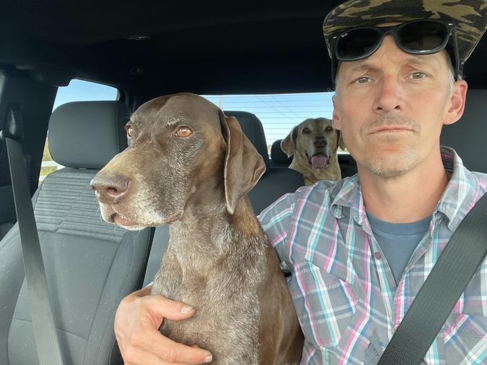Josh Parker, assistant superintendent of the Snake River Hotshots, with his dogs Winnie and Eddy on days off, September 2023. Photo courtesy Josh Parker