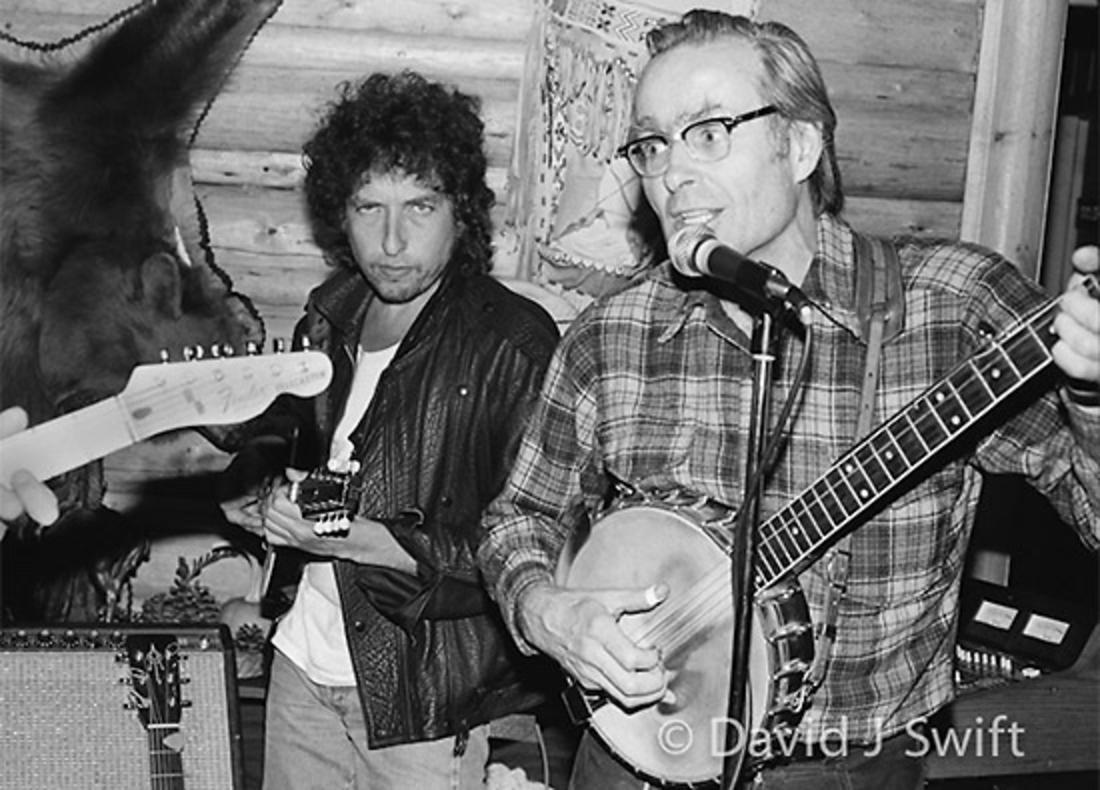 TWO LEGENDS: David J. Swift seems to know everyone in Jackson Hole. Here, years ago, he took a photo of a special guest musician joining Billy Briggs, player in the Stagecoach Band and  legendary skier who made the first ski descent of the Grand Teton. Moment was documented for posterity in a gig at Turpin Meadow Ranch.