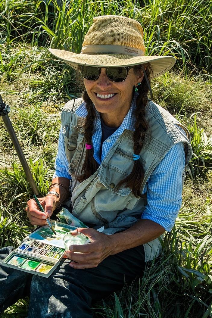 Artist Sue Cedarholm in the field.