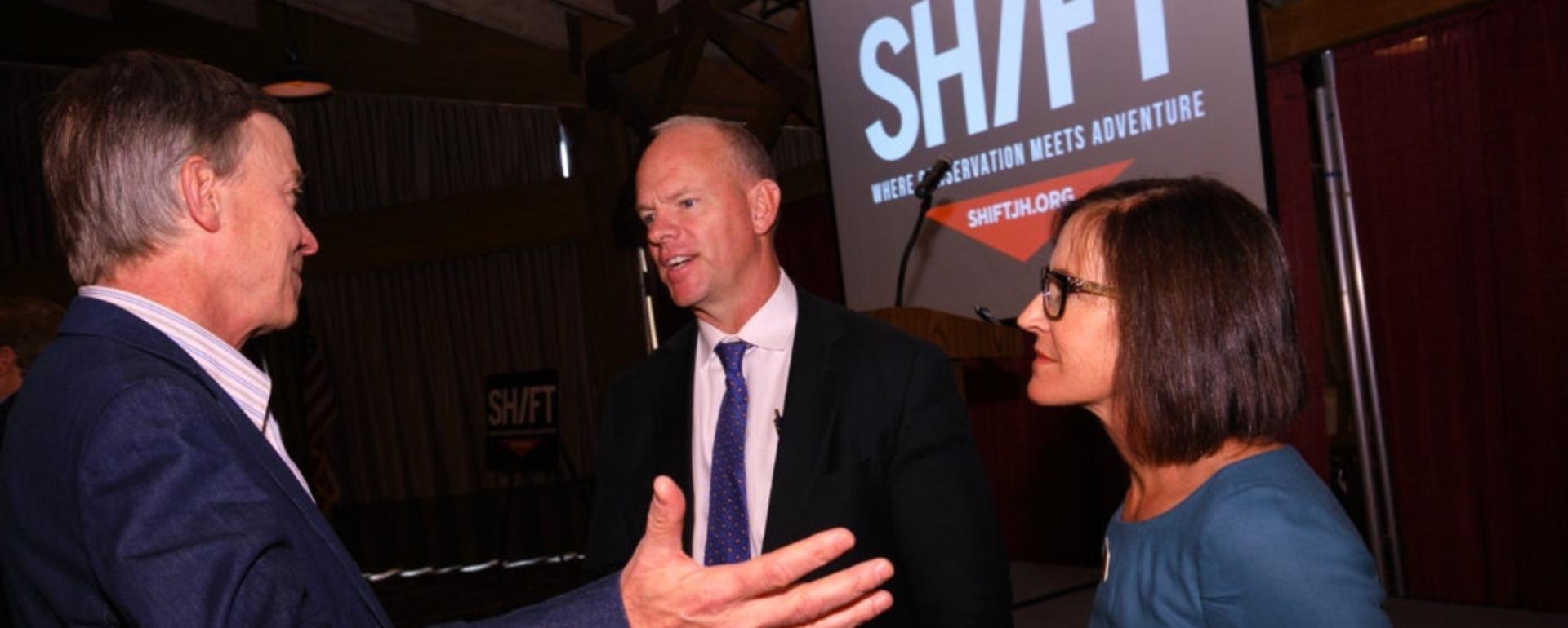 Sara Flitner, then serving as mayor of Jackson, Wyoming, meeting with Colorado Gov. John Hickenlooper, a Democrat,  and Wyoming Gov. Matt Mead, a Republican, at the 2016  SHIFT Festival in Jackson Hol