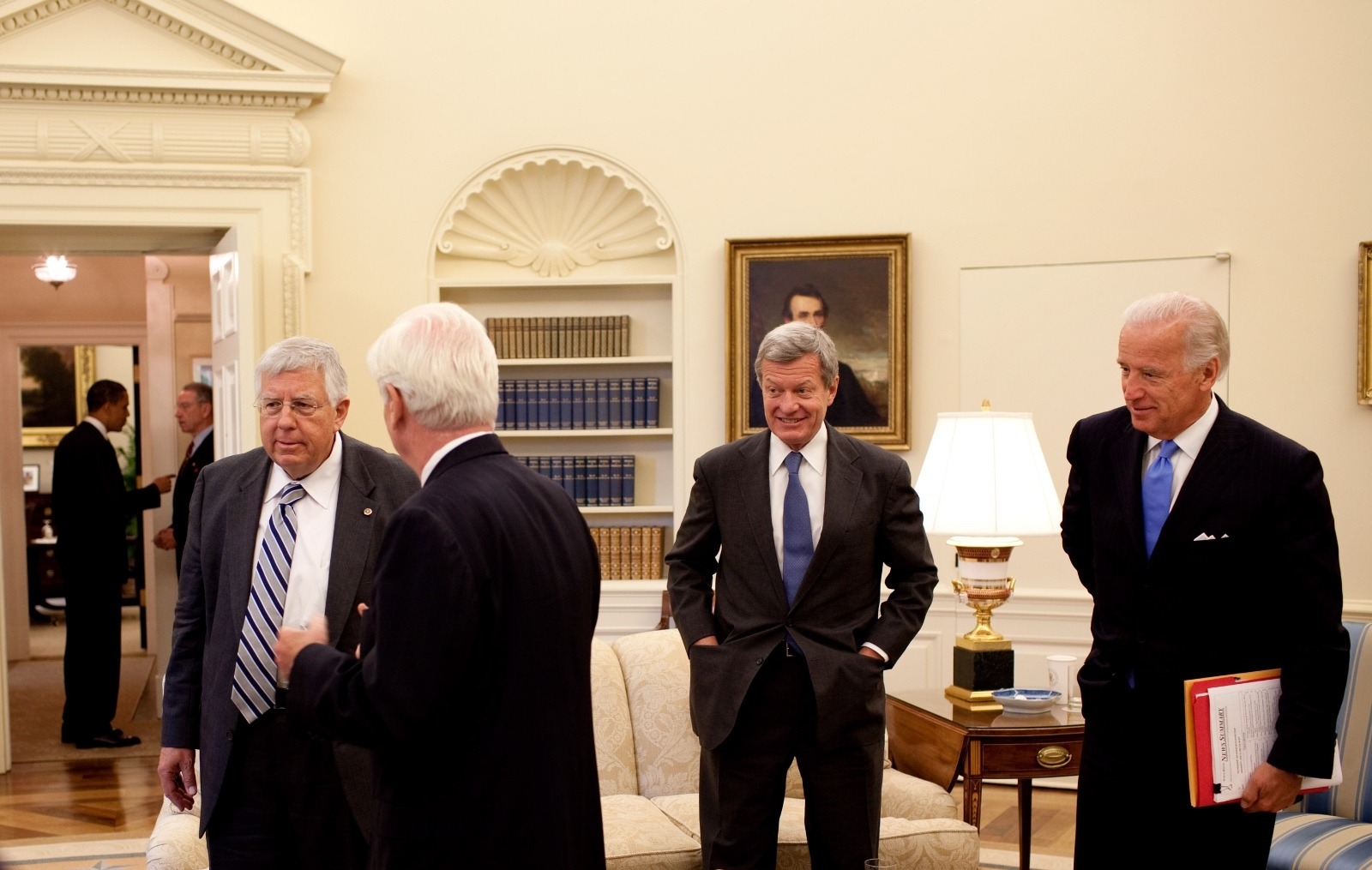 At a bi-partisan meeting in the Oval Office held in 2009 to discuss health care legislation, (l-r), President Barack Obama is seen in the background conversing with Sen. Charles Grassley (R-Iowa). In the foreground are Sen. Mike Enzi (R-Wyo), Sen. Chris Dodd (D-Conn.), Sen. Max Baucus, then chairman of the Senate Finance Committee, and Vice President Joe Biden.  Official White House Photo by Pete Souza