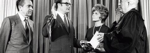 William Ruckelshaus being sworn in as the first chief administrator of the U.S. Environmental Protection Agency.  A policy institute, which promotes collaboration to solves disputes, bears his name at