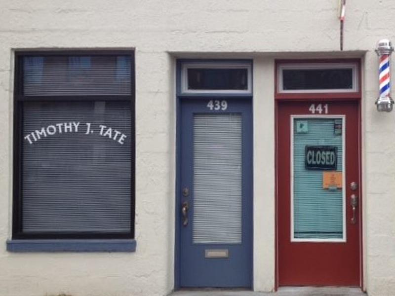 The author contemplates the meaning of red, white and blue from behind the door of his clinical therapy practice in downtown Bozeman, Montana