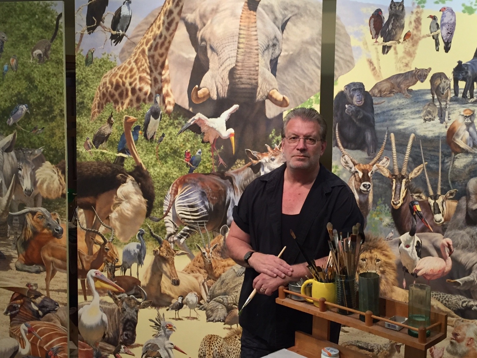 Brian Jarvi in the studio completing his epic masterwork &quot;African Menagerie: An Inquisition&quot;.  Featuring 209 species, it is 30 feet across and rises 1.5 stories. 