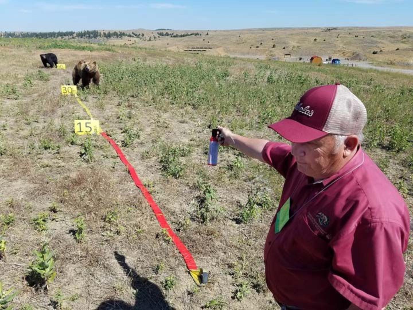 Bear spray crusader Chuck Bartlebaugh putting on a demonstration to show approximate distances for when to start pulling on the trigger of a can.