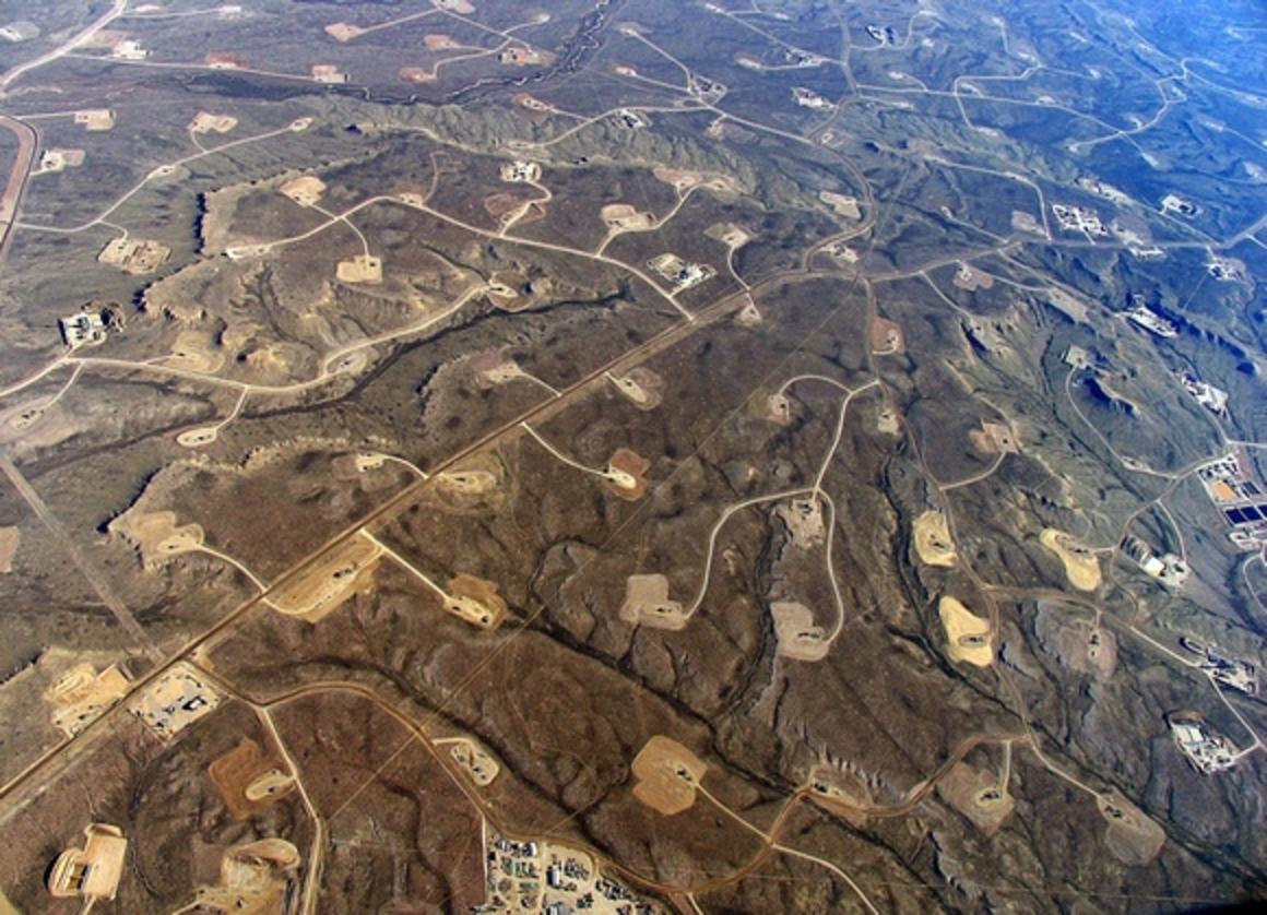 This is the vision of full-field natural gas development as permitted on public land by the U.S. Bureau of Land Management in the Jonah Field of western Wyoming near the foot of the Wind River Mountains. It has had devastating consequences for ungulate populations and sage grouse. Photo courtesy Ecoflight 