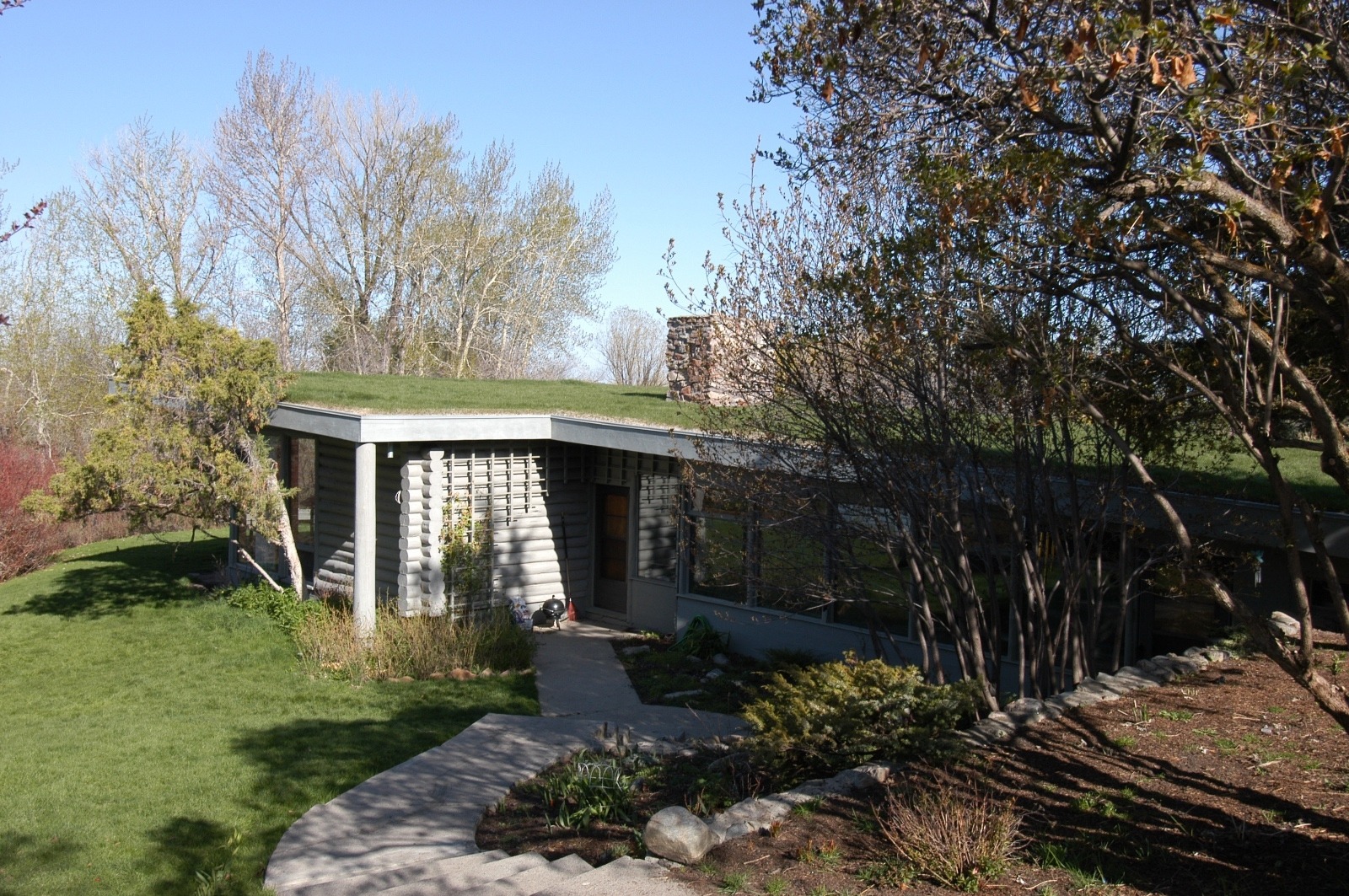 Besides concealment, low-slung sod-roof homes give occupants a more intimate connection to the earth and the grass absorbs heat, one small tool in addressing climate change. Photo by Joe Valerio