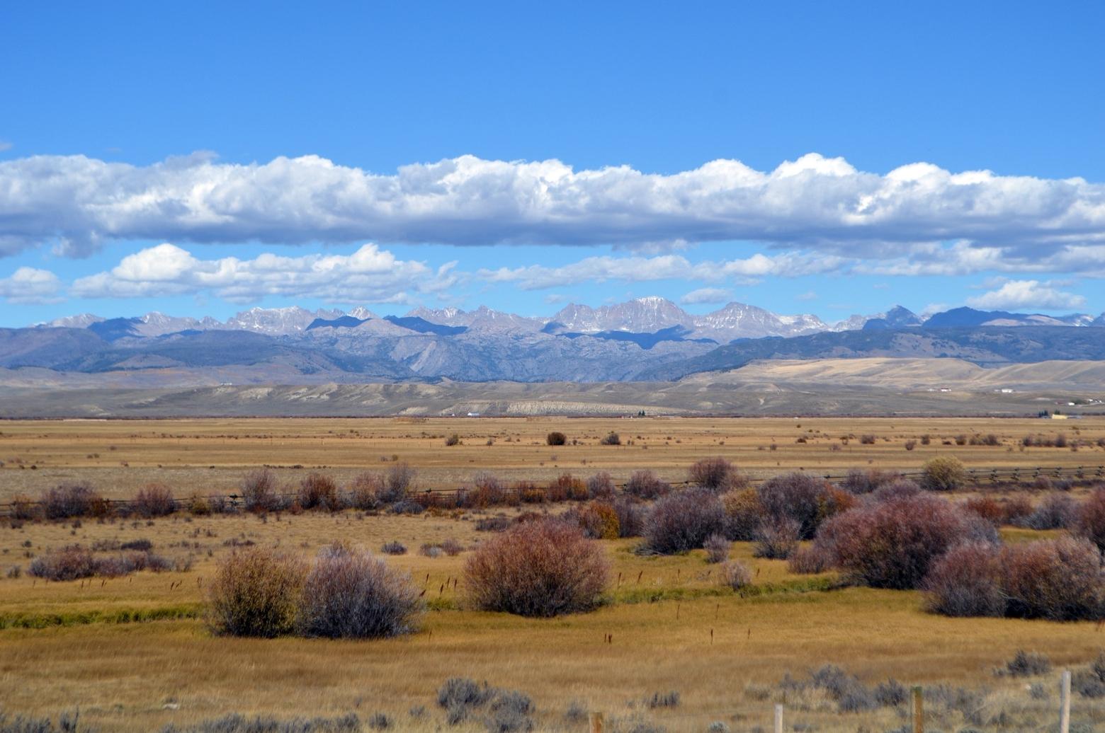 The Upper Green River Valley west of the Wind River Mountains in Wyoming is a mixture of private ranchlands and public lands stewarded by the U.S. Forest Service and Bureau of Land Management. Protection of private ranches is crucial to preserving ancient migration corridors for pronghorn, mule deer and elk. Sage-grouse leks, too, are found in the sagebrush open country and where natural gas drilling has occurred at industrial levels, sage-grouse have disappeared.  Photo Credit: Theo Stein / USFWS