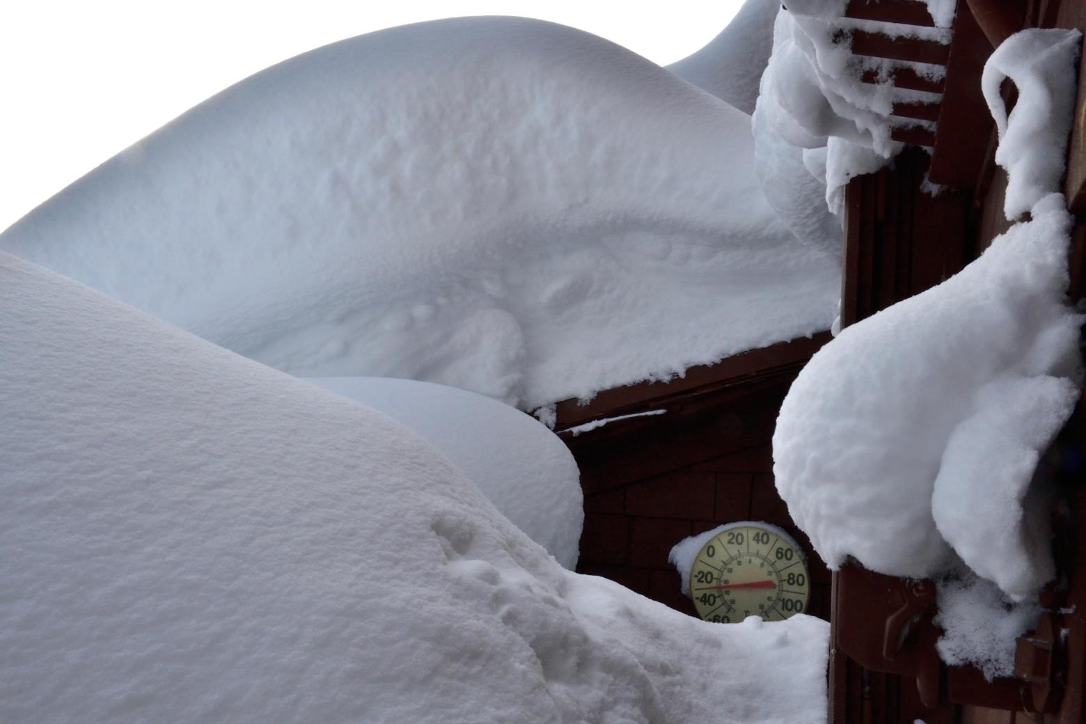 Overnight the temperature dropped to -30 degrees F according to the thermometer outside the back door.  I had to stand on tip toes in the doorway to make out the temperature over the drift. I passed the next two days digging up out from the door, excavating the snowmobile, and  breaking a snowmobile trail out to the road—all harder than it sounds. There is a lot more winter to come and I am seriously concerned that it will be necessary to put a ladder in the snow hole so as to get in and out of the door.