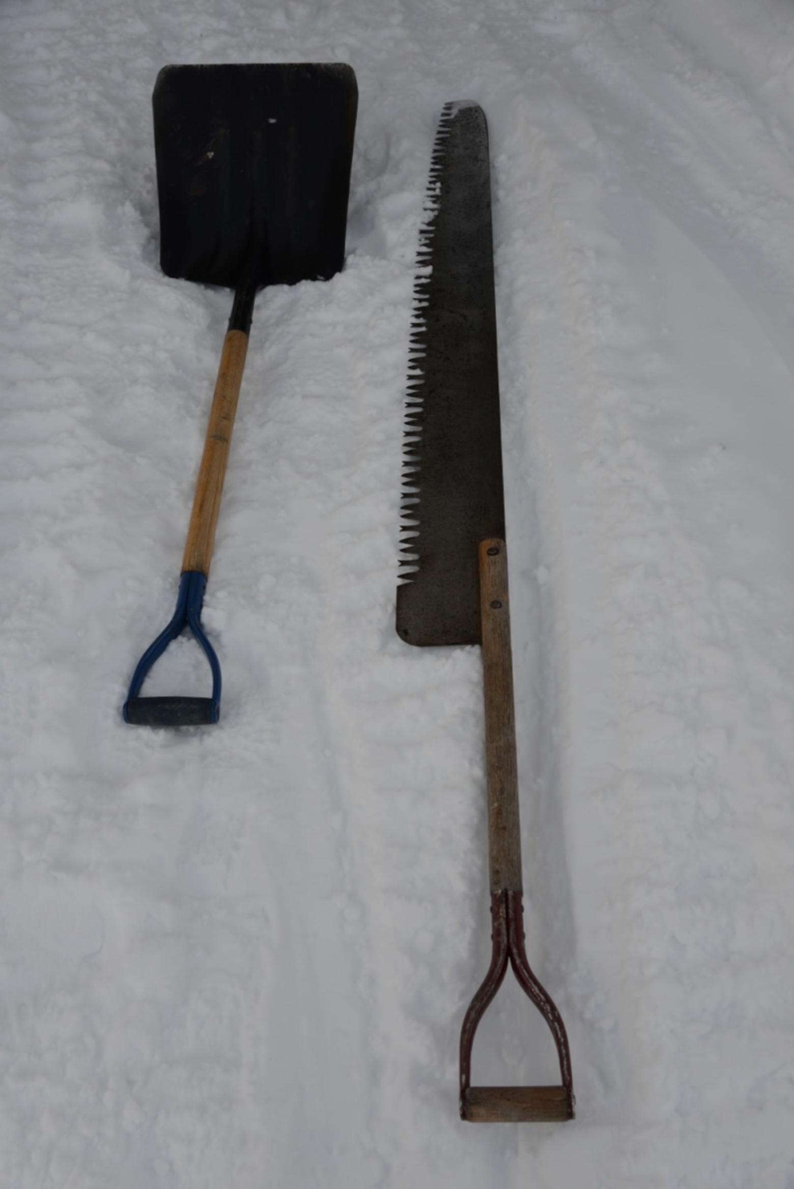 The winterkeeeper's humble tools of the trade. No snowblowers are taken up on a pitched roof.