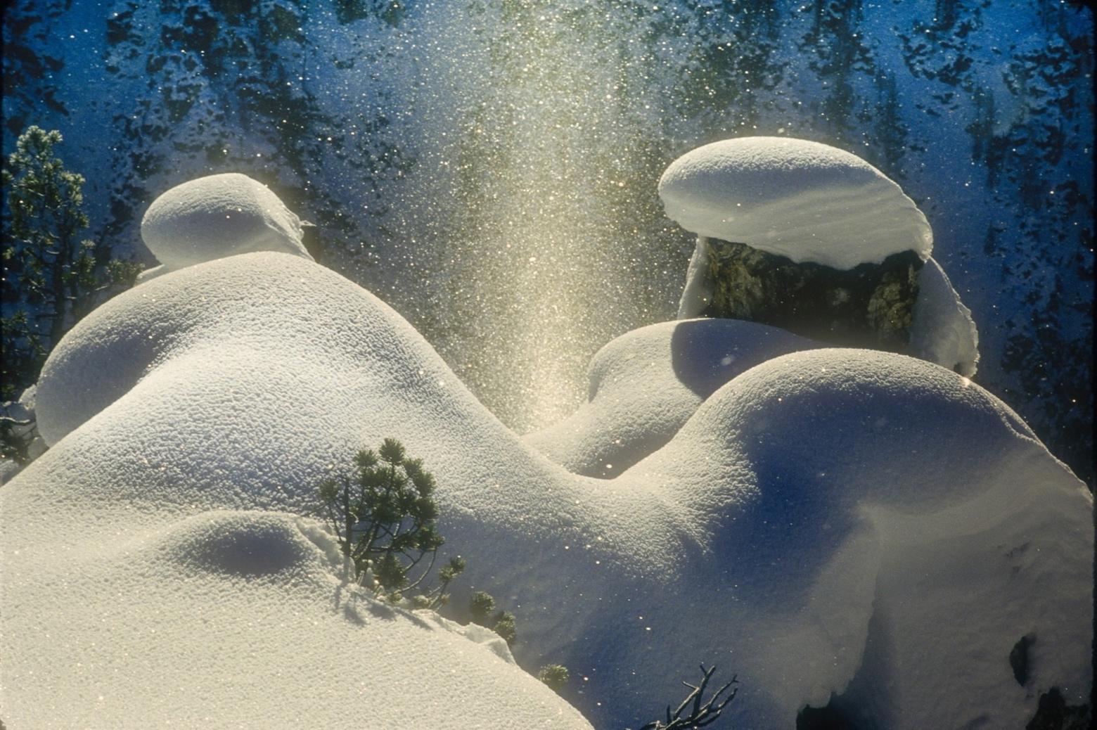 "On a sub zero morning, 'snow pillows' sit atop hoodoo rocks on the rim of the canyon and frame an ephemeral sun pillar," Fuller writes. Photo by Steven Fuller