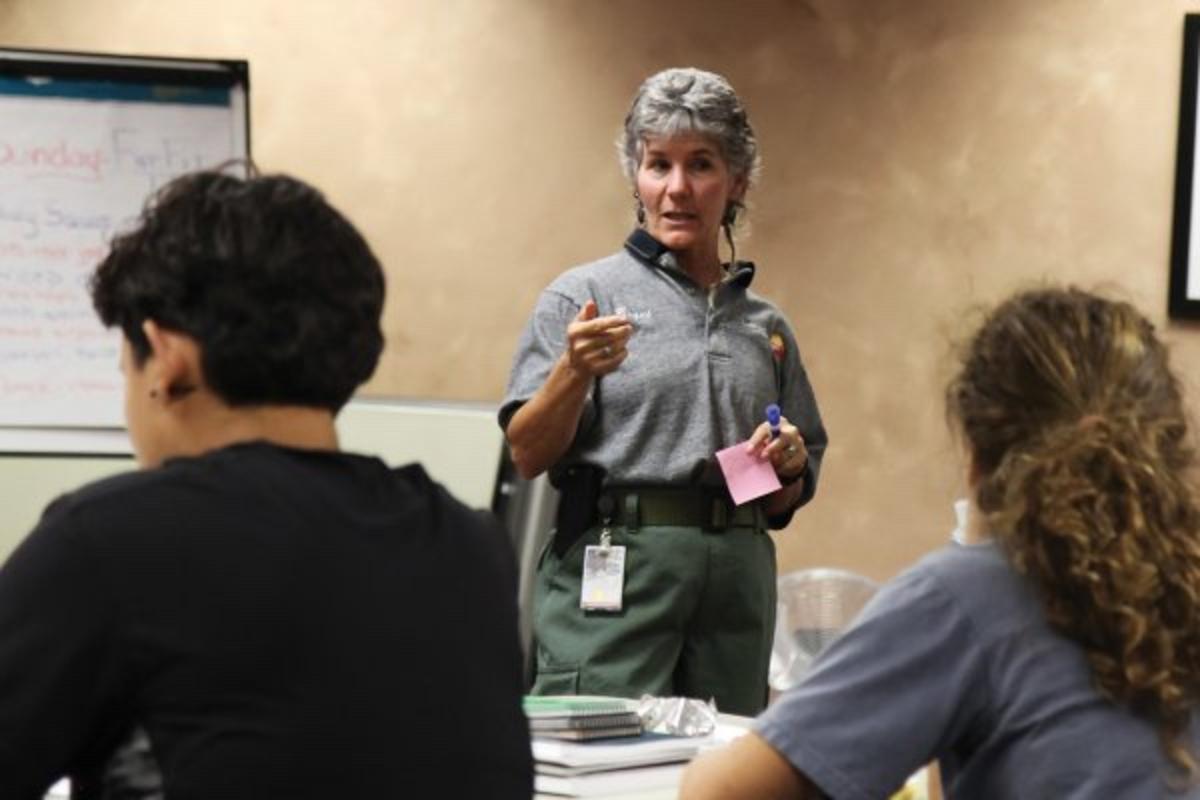 Women have made some strides in attaining leadership positions in federal and state agencies but resistance from the good old boy culture remains a problem.  Here, Bequi Livingston leads the “Women In Wildfire” bootcamp, started in 2012 to empower women to break into the predominantly male wildfire corps. (Kristen Honig/National Park Service)