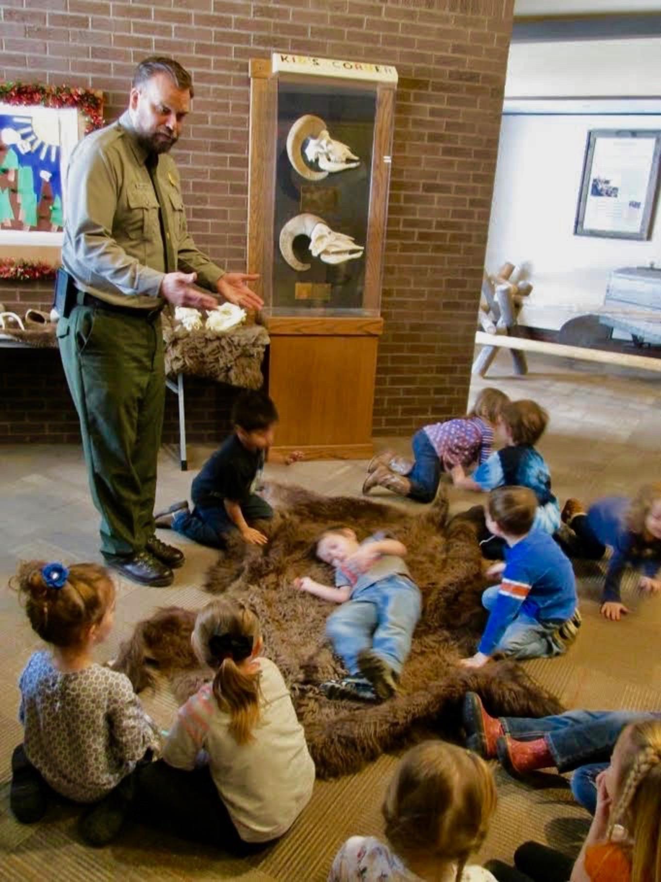 As important as his military career was, Johnson takes his mission on the homefront equally as seriously. Here he's educating local school kids about wildlife, hoping to infect them with what E..O. Wilson calls "biophilia."  Photo courtesy Todd Johnson