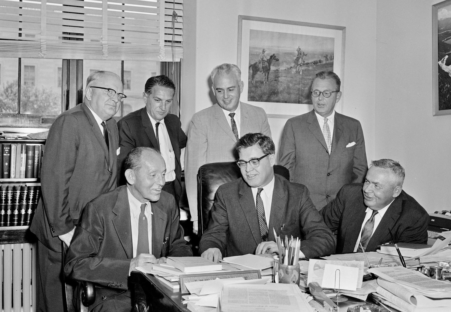 National conservation leaders meet with Metcalf in August 1961 to discuss legislative strategy regarding the proposed national wilderness preservation system bill.  Pictured, left to right, standing, Alden J. Erskin, president of the Izaak Walton League; Phil Schneider, president of the International Association of Game, Fish and Conservation Commissioners; Tom Kimball, executive director of the National Wildlife Federation; Carl W. Buchheister, president of the National Audubon Society; and left to right, seated, C.R. Gutermuth, chairman of the Natural Resources Council of America; Metcalf; and Ira N. Gabrielson, president of the Wildlife Management Institute.
