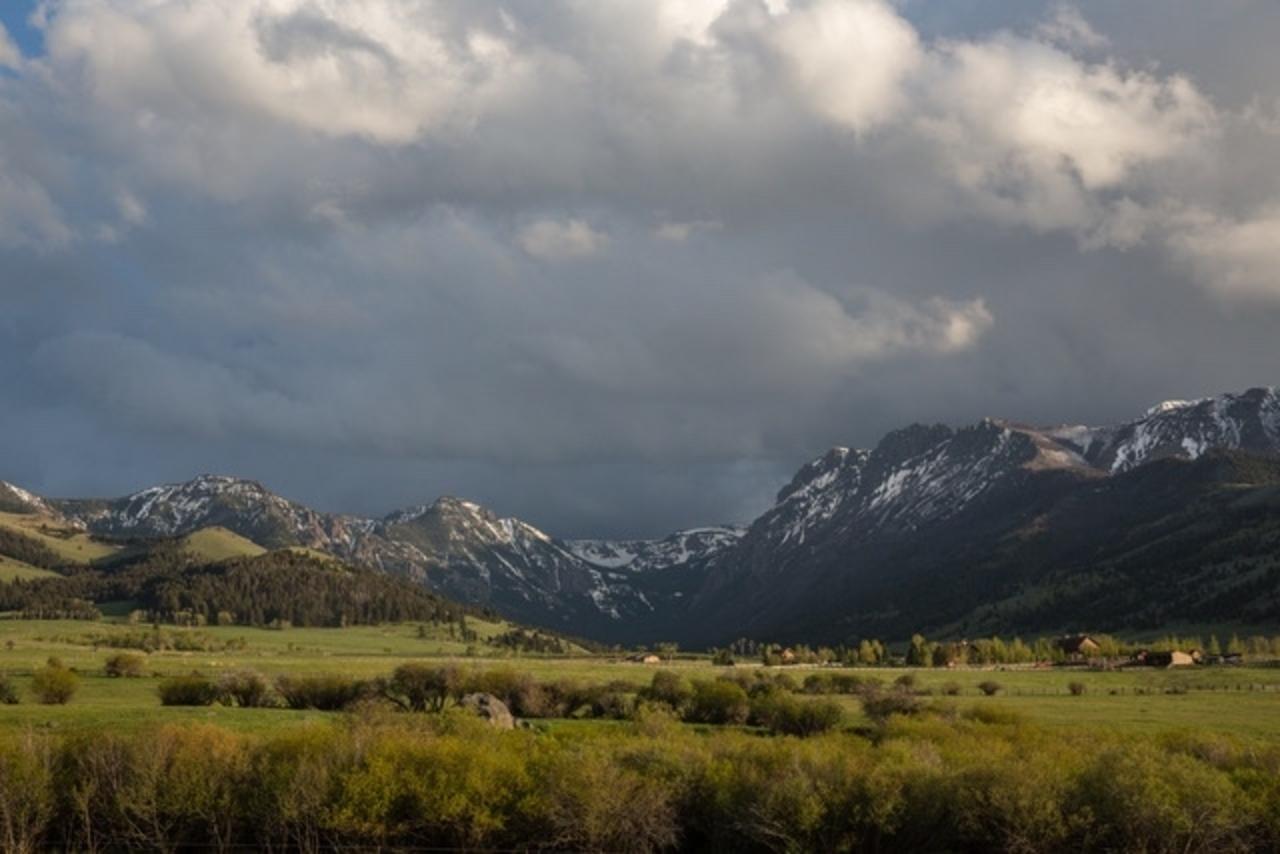A moody view of Tom Miner Basin north of Yellowstone. Louise Johns notes, "Julie describes her first time in Tom Miner Basin as 'a spiritual energy that held me like a womb. An old family energy. And the horse was an extension of the landscape from a spiritual and physical aspect. You can reach the ridgelines, and your world becomes boundless.'" Photo by Louise Johns