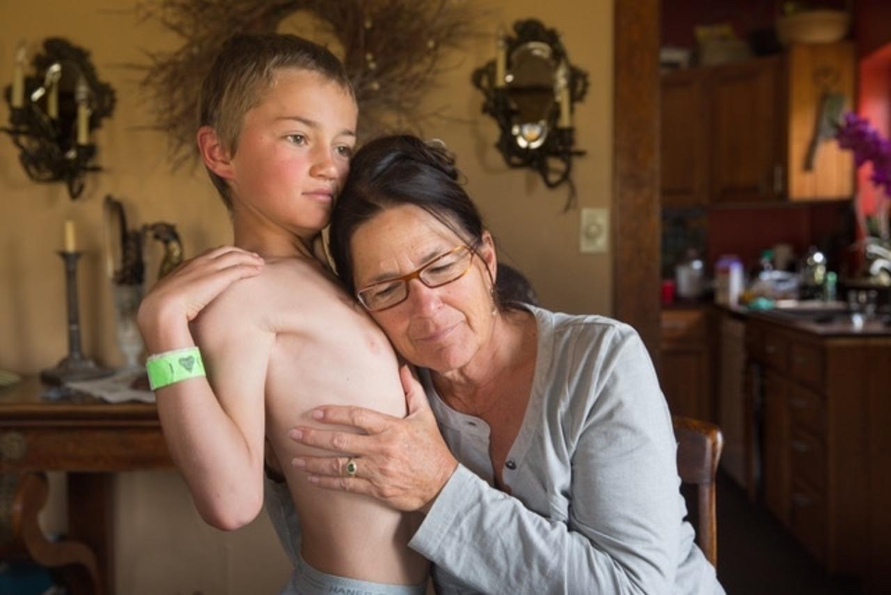 Julie Anderson greets her nine-year-old grandson, Andy, in the morning at grandmas's ranch home. Photo by Louise Johns