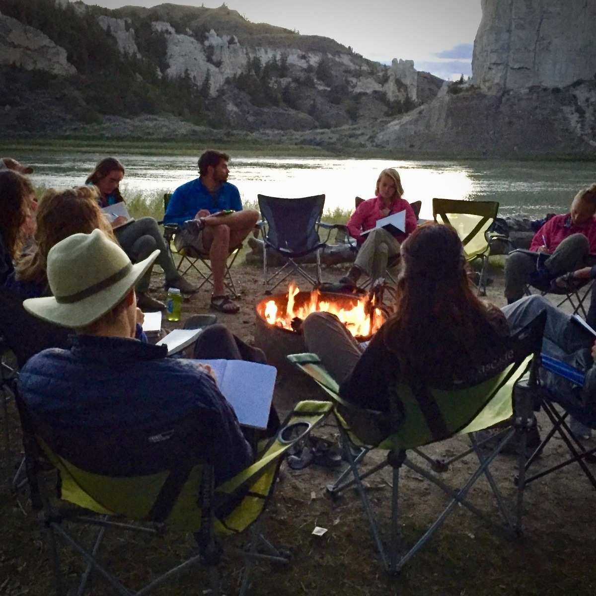 Whitman College's &quot;Semester in the West&quot; students, also known as &quot;Westies,&quot; gather to discuss events of the day. Every evening, students come together in a circle and share observations.  They are camped along the Upper Missouri River in Montana discussing the indigenous West, Lewis &amp; Clark, and the Upper Missouri River Breaks National Monument.  Semester in the West, which involves students ground-truthing myth, legend, culture and politics, is led by Snow's colleague, Phil Brick, but together, at the campus in Walla Walla, Washington, they and colleagues have tried to build a place-based curriculum. Photo by Todd Wilkinson