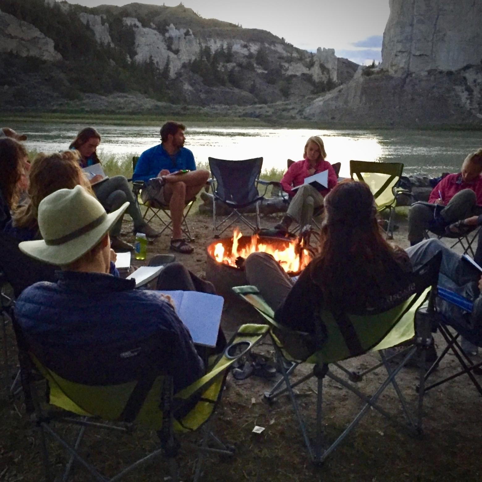 Whitman College's "Semester in the West" students, also known as "Westies," gather to discuss events of the day. Every evening, students come together in a circle and share observations.  They are camped along the Upper Missouri River in Montana discussing the indigenous West, Lewis &amp; Clark, and the Upper Missouri River Breaks National Monument.  Semester in the West, which involves students ground-truthing myth, legend, culture and politics, is led by Snow's colleague, Phil Brick, but together, at the campus in Walla Walla, Washington, they and colleagues have tried to build a place-based curriculum. Photo by Todd Wilkinson