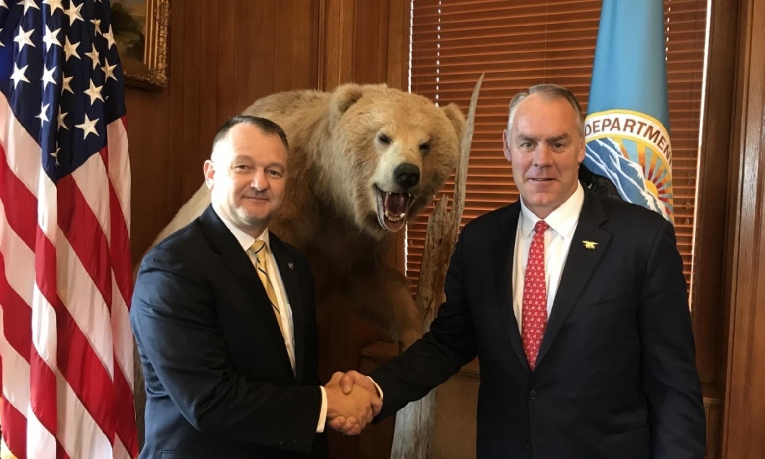 Interior Secretary Ryan Zinke gives Cameron "Cam" Sholly a congratulatory handshake after making him the next superintendent of Yellowstone. For Sholly, it is a homecoming.  He spent his high school years in the park while his father served as chief ranger. Photo courtesy U.S. Interior Department