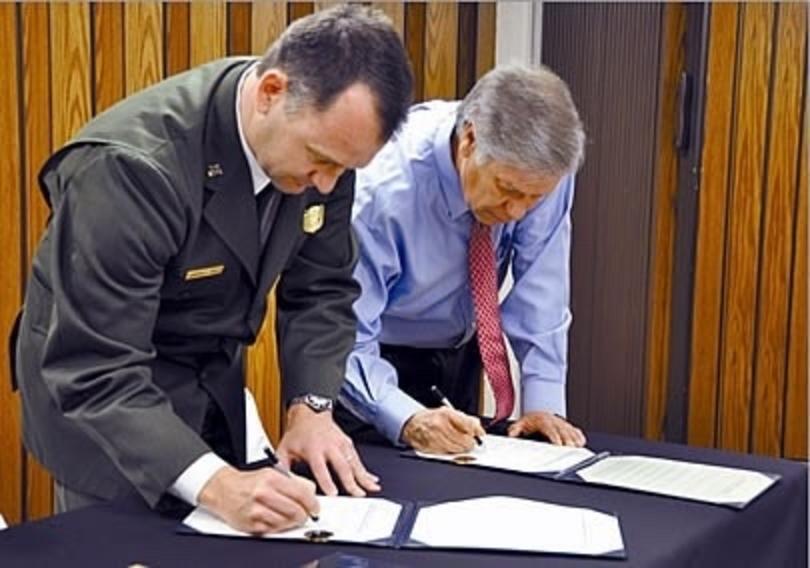 Choctaw Nation Chief Gregory Pyle and Cam Sholly sign a repatriation agreement officially transferring custody of 124 remains to the Choctaw Nation. 