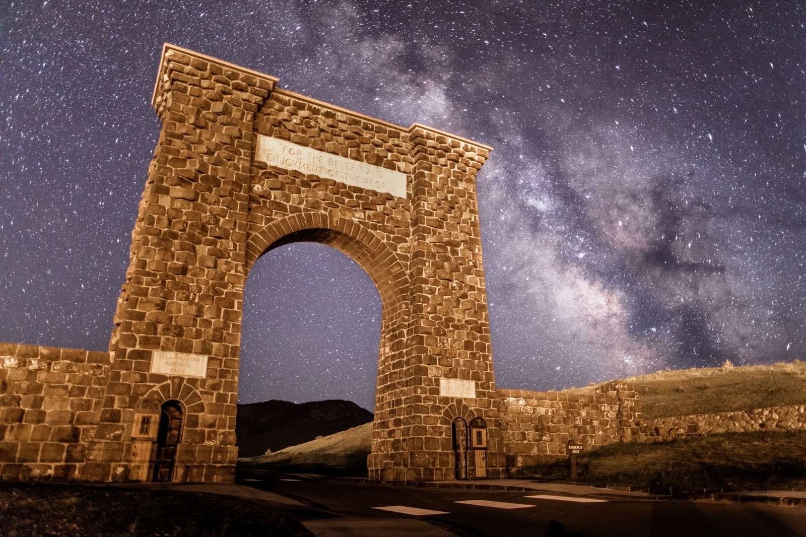 Yellowstone's Roosevelt Arch and its timeless slogan beneath the cosmos. Photo courtesy Jacob W. Frank/NPS