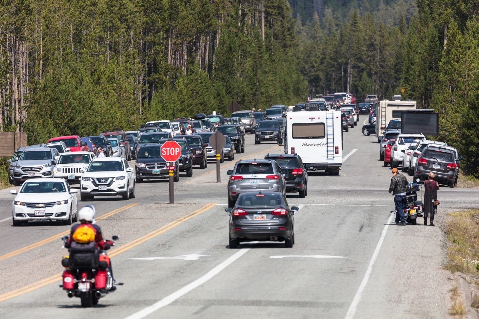 Traffic at Norris Junction. Based on several data points, visitation to Yellowstone is exceeding the park's ability to deal with the growing masses and is past the point of resource sustainability.  Under Wenk's leadership, Yellowstone has taken a serious look at carrying capacity issues and the recognition that in order to maintain the integrity of Yellowstone there must be discussions about limits to the number of people during the crush of peak tourist season. In some ways the has already happened with winter use in Yellowstone and caps put on snowmobiles. Photo by Jacob W. Frank/NPS