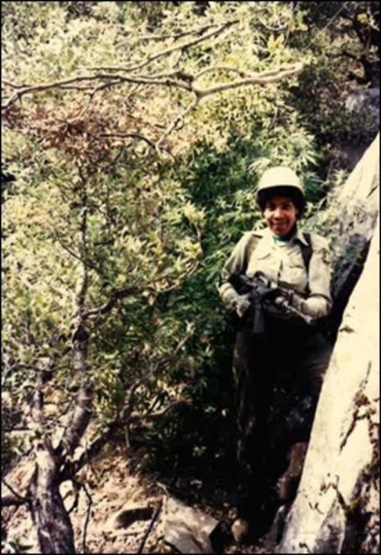 Mobley toting a semi-automatic rifle while on a team to locate illegal marijuana growers on the Humboldt-Toiyabe National Forest in Nevada.