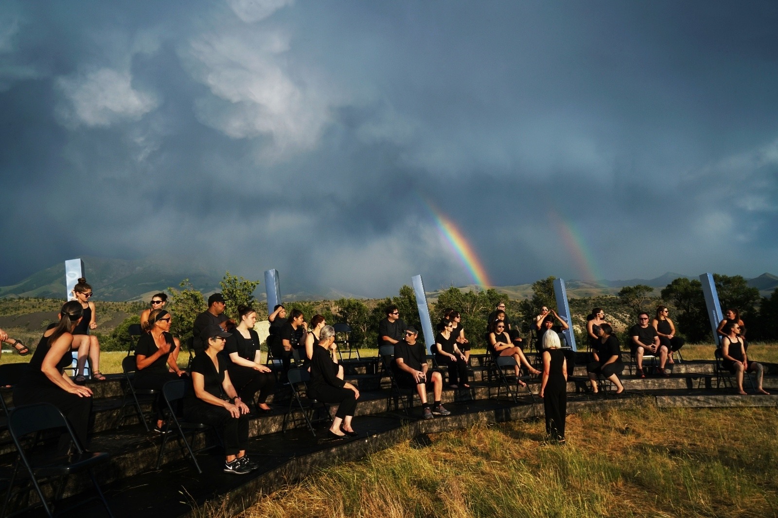 The Symphonic Body / Water performance, with a rainbow,  conducted by Ann Carlson at Mountain Sky Guest Ranch in Paradise Valley, Montana.  Photo by Elly Stormer Vadseth