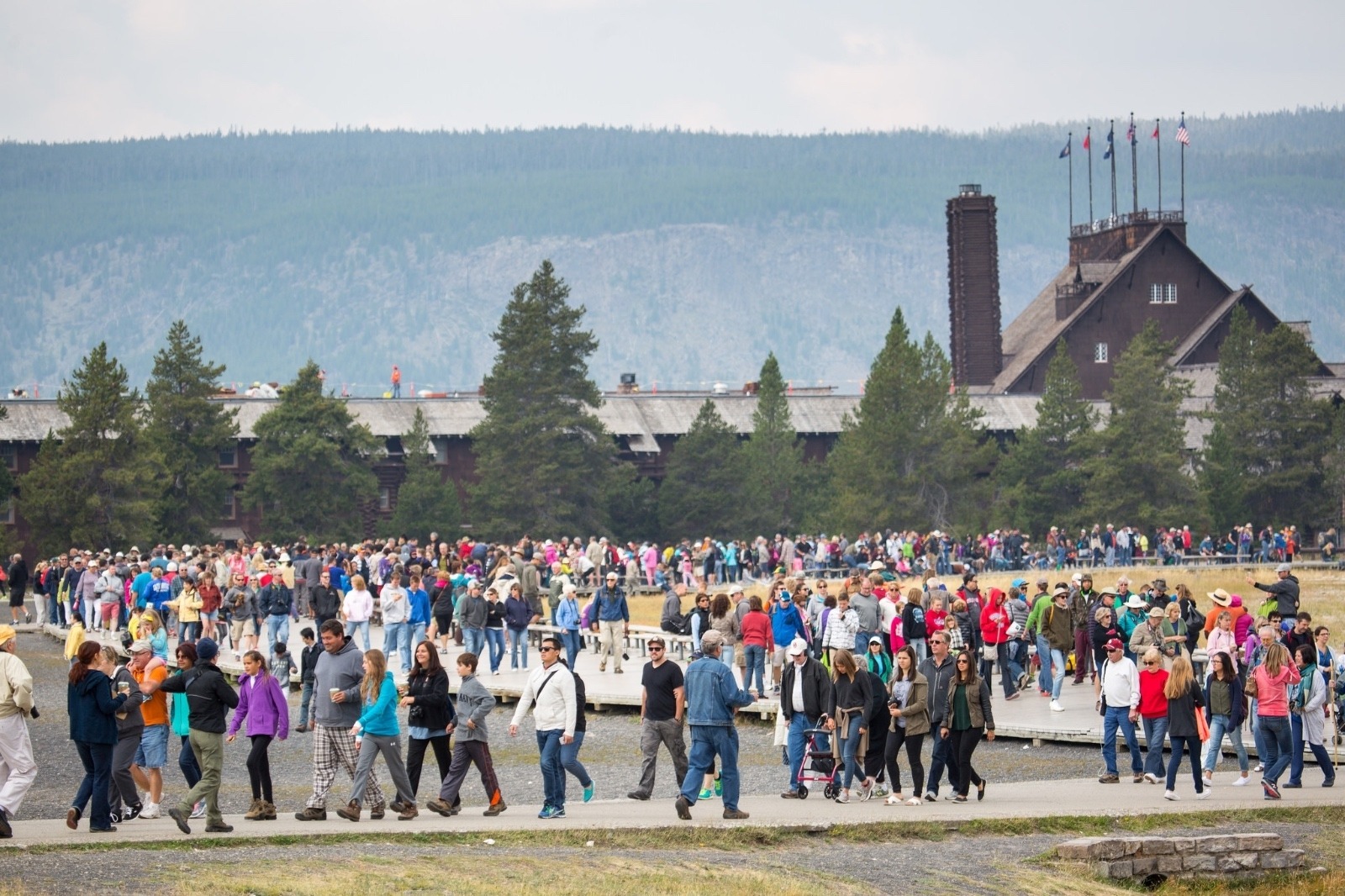 Crowds departing after watching Old Faithful Geyser erupt in Yellowstone. Photo courtesy Neal Herbert/NPS
