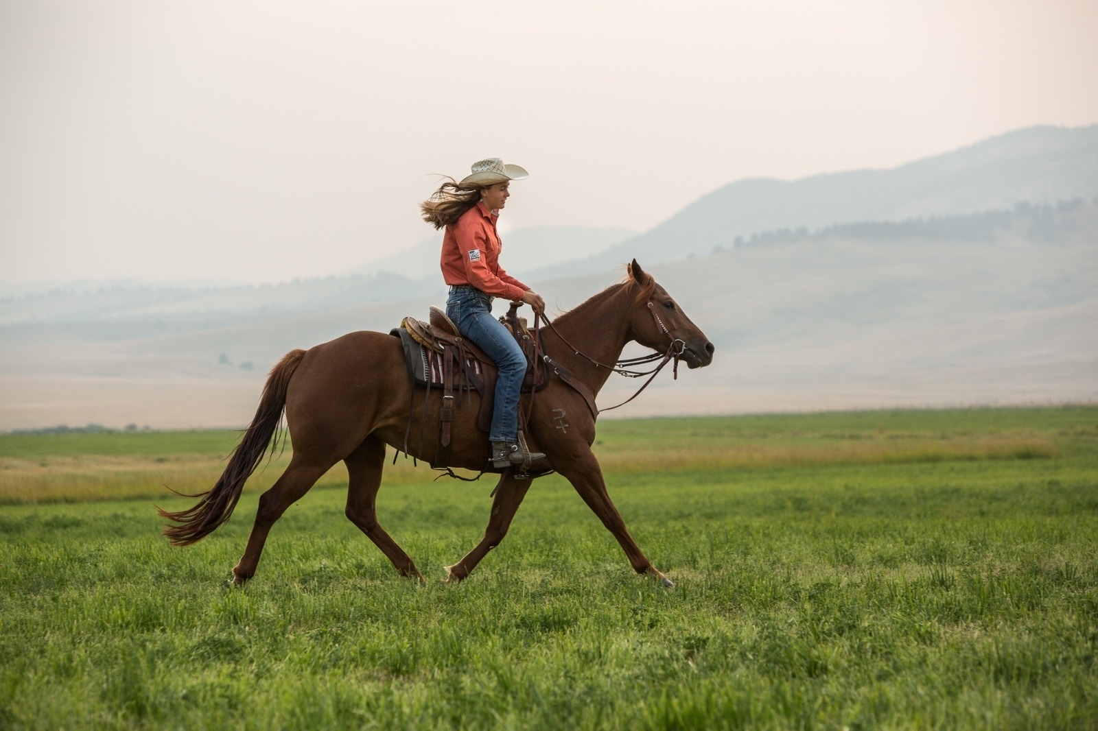 Irene Johnson rides her horse, Perky, on the U-Cross Ranch outside of Roy, Montana. Photo by Louise Johns