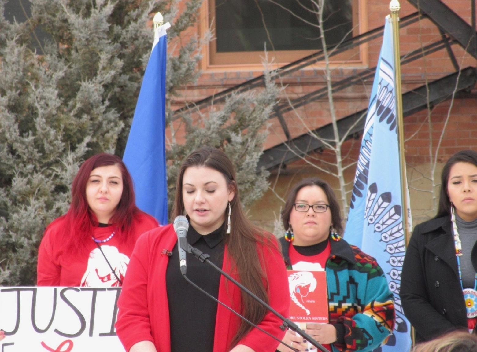 Erika Ross, flanked by indigenous women from across Montana, delivered remarks based on her exhaustive research. Photo by Phil Knight