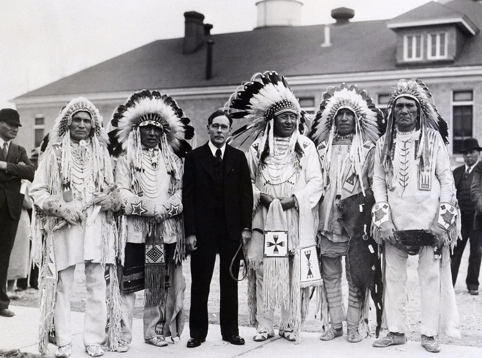 John Collier, reforming commissioner of the Bureau of Indian Affairs, the oldest agency in the US Interior Department, meets with members of the Blackfeet Nation in 1934.  Collier, a controversial figure, tried to reverse centuries of racist and genocidal policies toward native people through the &quot;Indian New Deal&quot; which was itself flawed and met with hostility from indigenous people who felt he perpetuated his own patriarchal, racist stereotypes. Photo courtesy Library of Congress