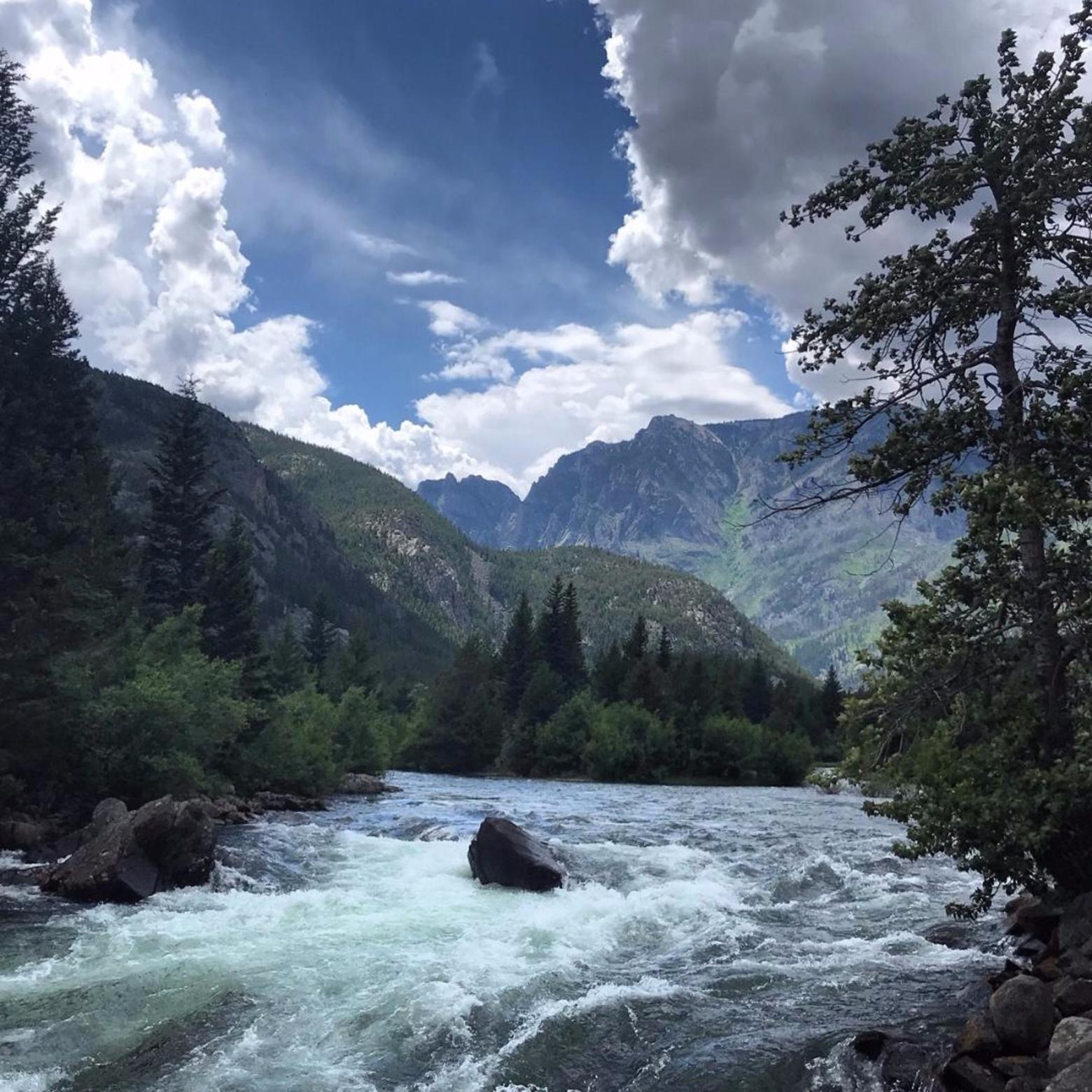 The Stillwater River and the chasm of the canyon forged by rushing water. When we stop to listen, what do we hear?  Photo courtesy Timothy Tate