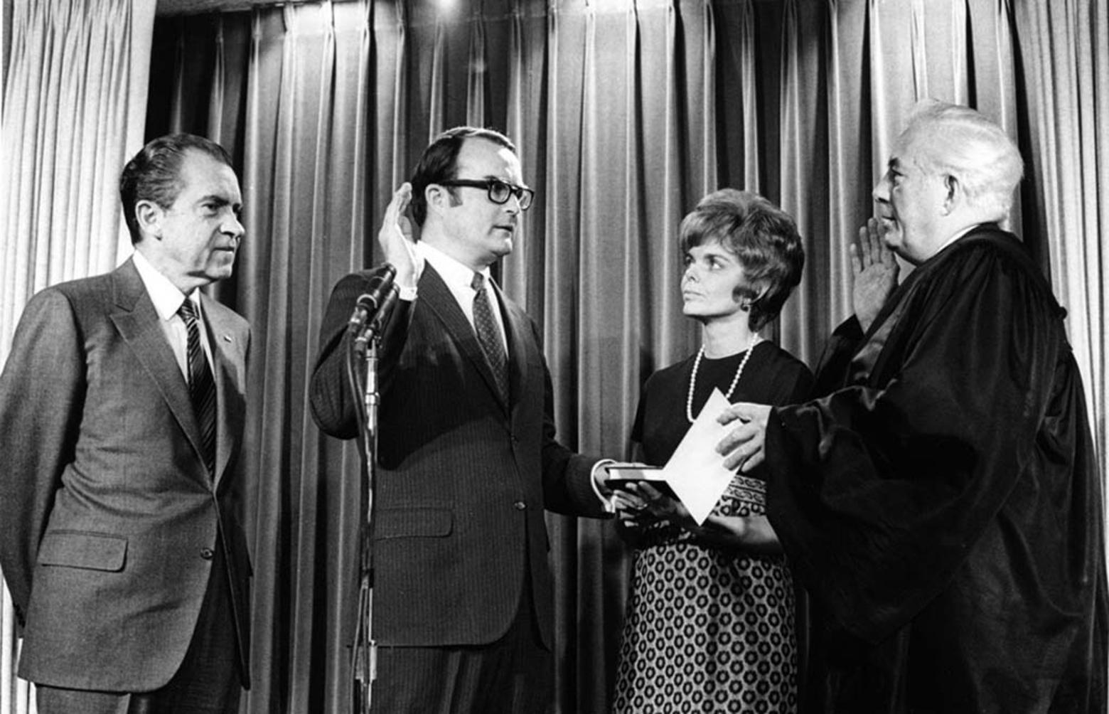 William D. Ruckelshaus being sworn in as the first-ever administrator of the US Environmental Protection Agency in 1970 with President Richard M. Nixon who appointed him standing at his side. Two years later, Ruckelshaus, acting on a growing mound of scientific evidence recommended that Nixon ban biocides used to protect livestock.  Nixon issued an executive order overturned by Ronald Reagan though the problems raised about the dangers of biocides have only grown. Photo courtesy US EPA