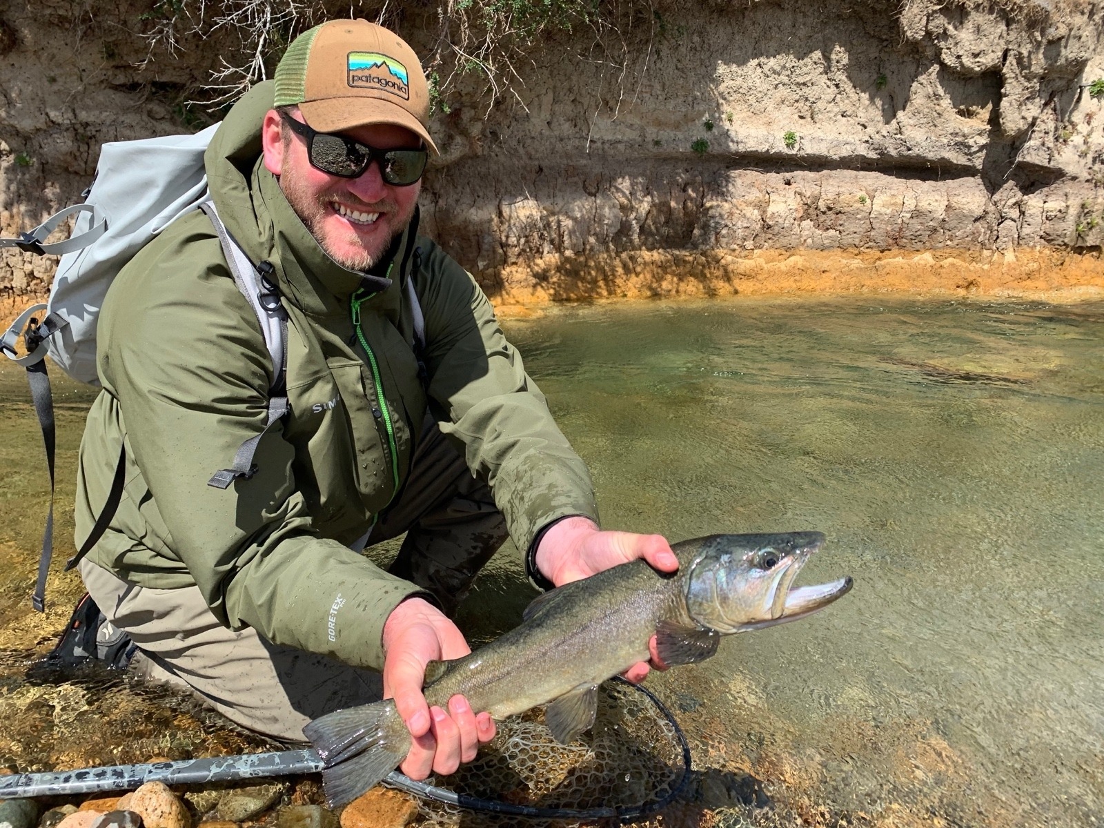 The angling skills Person honed while plying the waters of Montana have come in handy in stalking fish around the world.  Here he holds a trout landed in Argentina's Patagonia region.  Photo courtesy Mike Person