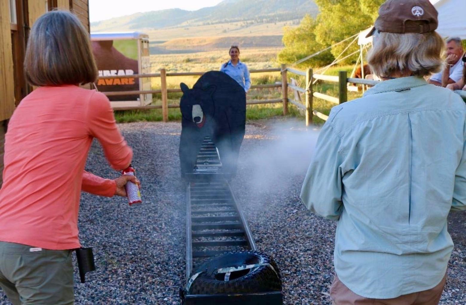 Even when carrying cans of bear spray, not all outdoor travelers are prepared to deal with a moment of truth. Here, Oyler leads a bear spray clinic using a simulated bruin.  Photo courtesy Danielle Oyler