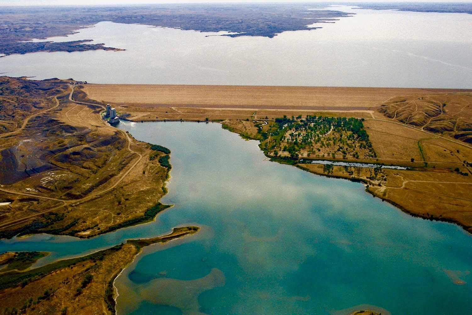 Fort Peck:  Lois Red Elk writes from the place where a mighty river, the Missouri, (Mníšoše) turns into a massive artificial tarn, surrounded by an bigger ocean of prairie.  Photo courtesy U.S. Army Corps of Engineers