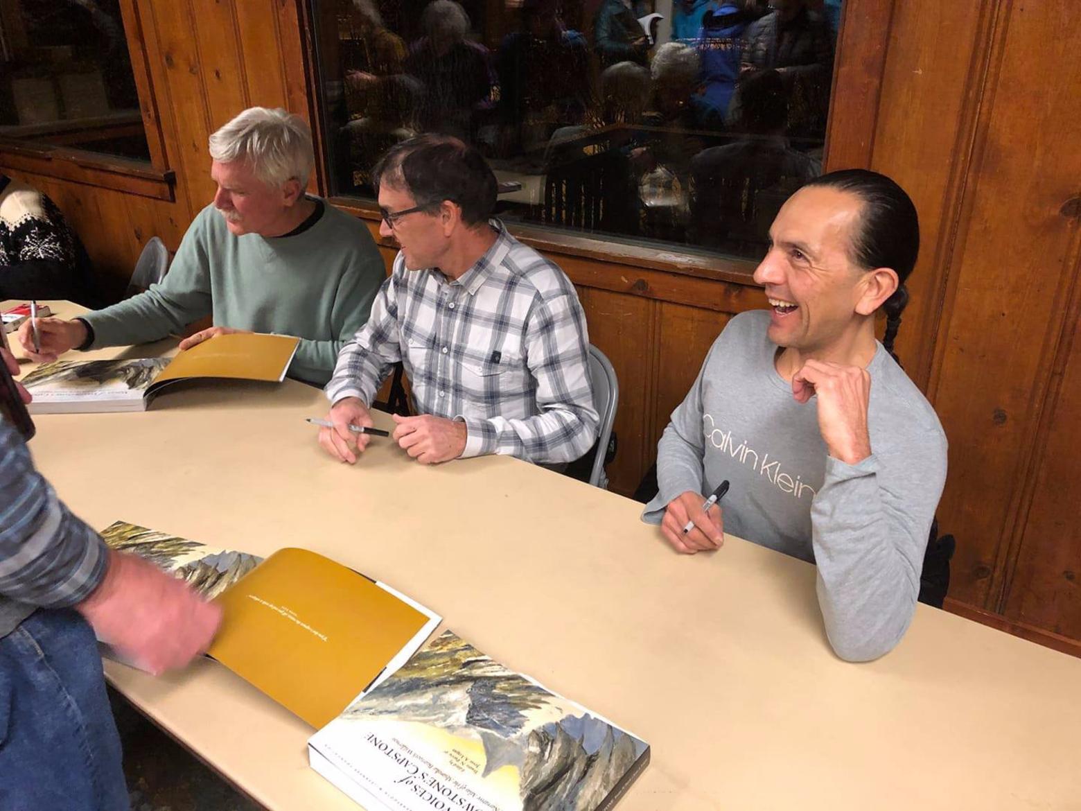 Writers Gary Ferguson, Doug Chabot and Shane Doyle sign copies of the book. They are among the 28 authors, 17 artists and nearly 50 photographers whose work is featured in the Atlas.  Read Doyle's essay in a special excerpt now up at Mountain Journal.