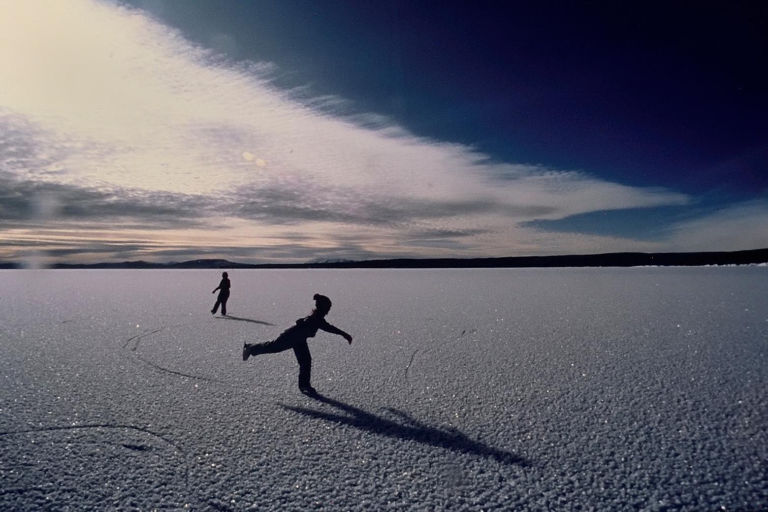 Pirouetting on wild ice. "My daughters learned to skate on Yellowstone Lake," Fuller says. "As the surface of the lake freezes solid for the winter (see photo top) the ice expands and stress cracks shoot across the sheet for miles, sometimes many simultaneously, their eerie sounds create 'the music of  the Lake."  Photos by Steven Fuller