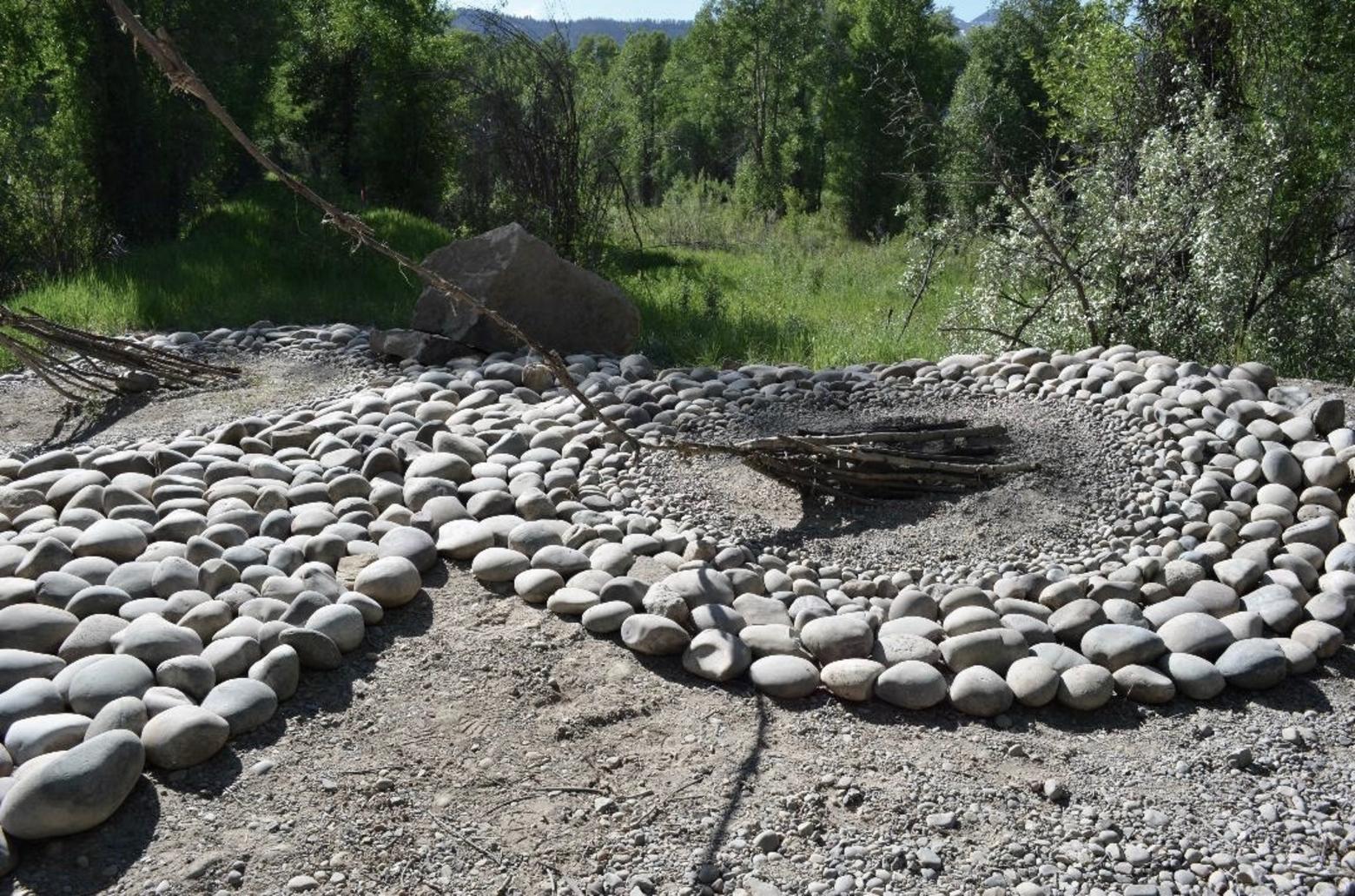  An artful swirl of cobble and soothworn river rock assembled for the opening of Rendezvous Park along the Snake River in Jackson Hole served as a project for Remote Studio students as well as a muse for place-based thinking. It also serves as a venue where visitors can reflect on the elements of "natural architecture" present in the Snake River corridor. In the end, part of the installation, ephemeral by design, will over time be reclaimed by the river during high water—a reminder that long-lasting lessons can be imparted without having to be memorialized by permanent human construction. Photo courtesy Hance Hughes. 