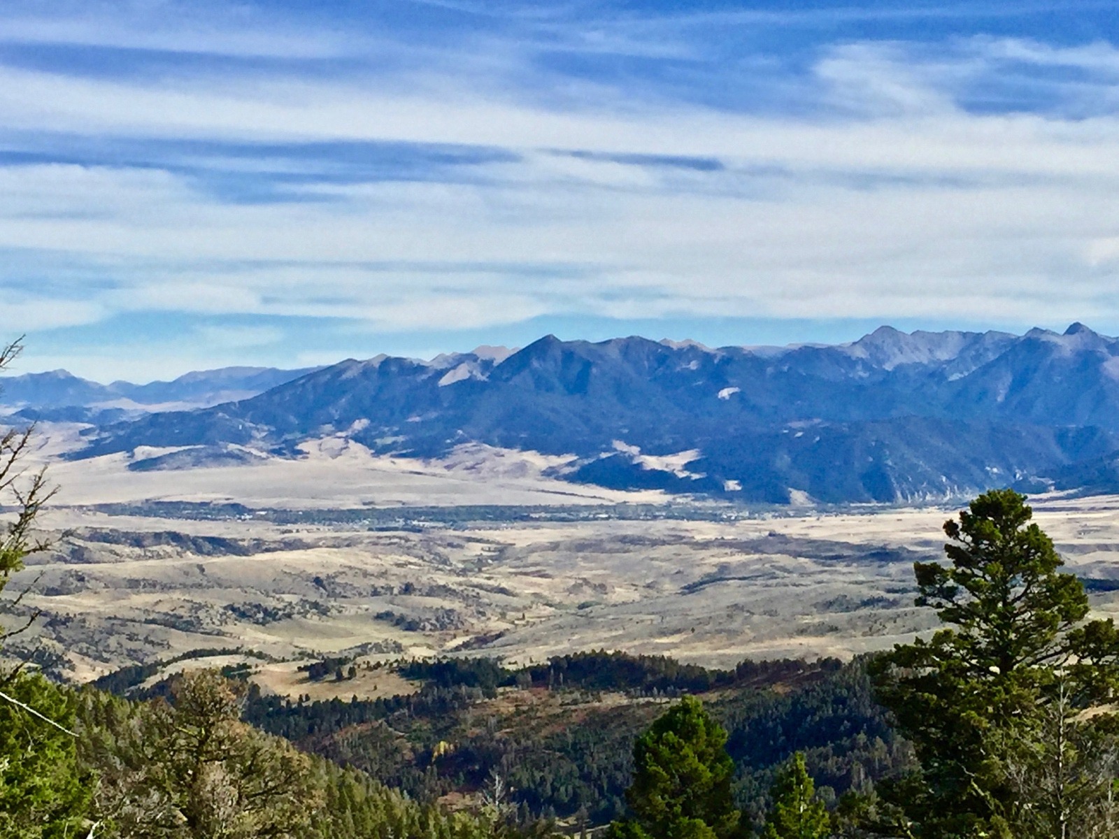 As viewed from the Bangtails looking east, the town of Livingston, Montana sits along the Yellowstone River at the northern terminus of the Absaroka mountains.  Today, Livingston and Park County are concerned about the spillover effects of population pressure coming from Gallatin County and Bozeman, one of the fastest growing micropolitan cities in the US.  The down-home character of Livingston and Paradise Valley are enhanced mightily by the pastoral countryside and public lands around it.  While some important conservation easements are in place, how would the feel of the community change were large-scale subdivisions to be approved and what would happen to the corridors of open space that provide passageways for migratory elk and mule deer? Photo by Todd Wilkinson
