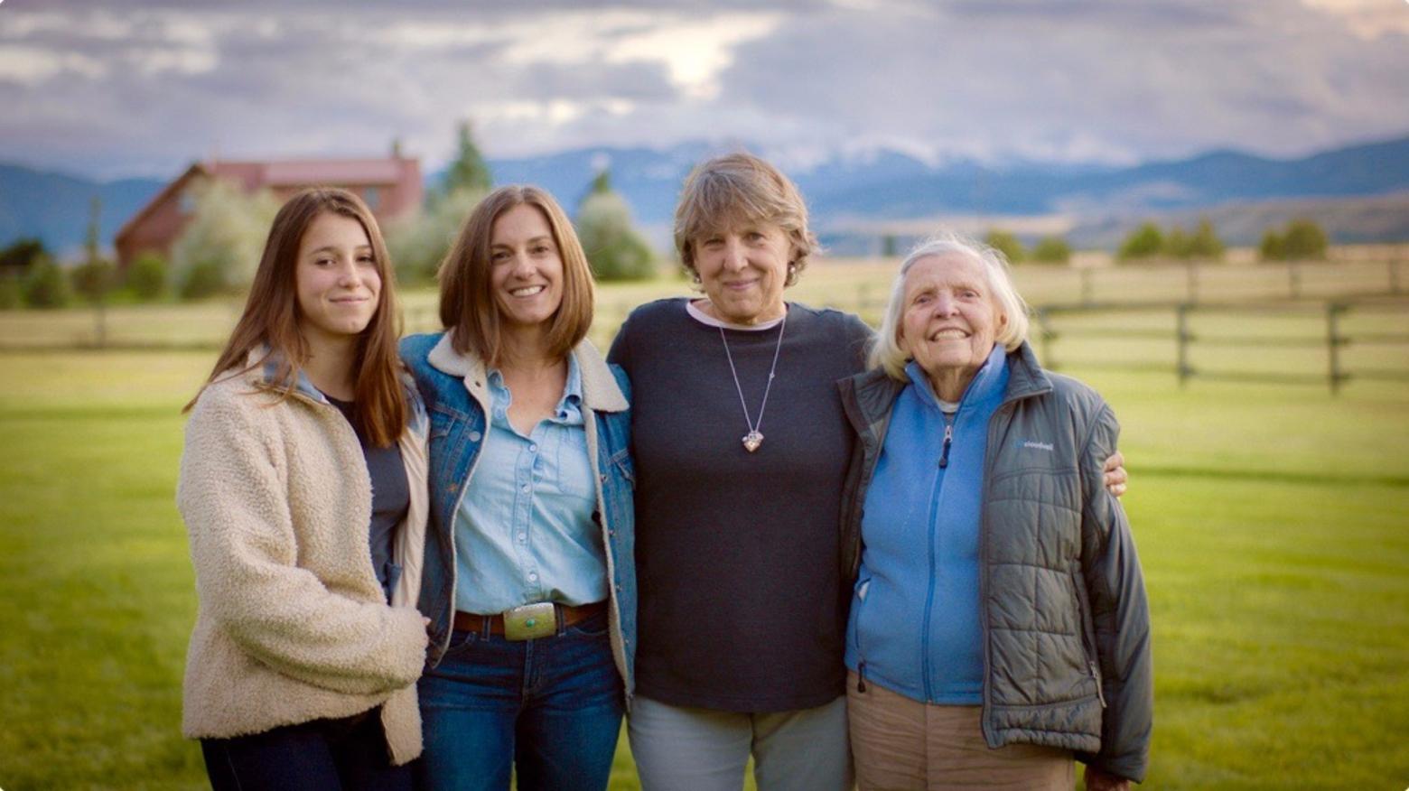 Top: Raised in the outdoors, Neumann (far left) is pictured in this vacation photo taken during a family camping trip to Glacier National Park. Next to her is her mother, Nonnie, step-Dad, David and her late brother, Wyatt.  Lower photo: four generations of Montana women in her clan, including her daughter (at left) and grandmother, (far right). 